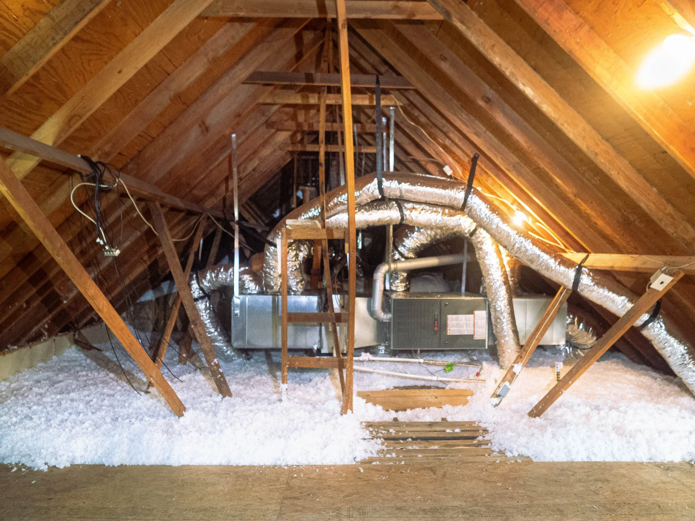Superior Attic insulation contractor working in a Dallas-Fort Worth attic