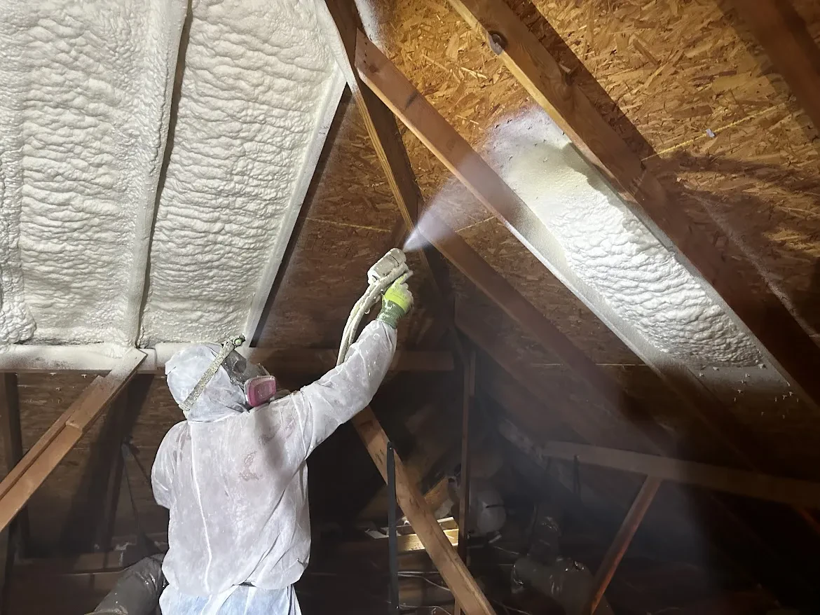 Spray foam sealing gaps in a framed cavity